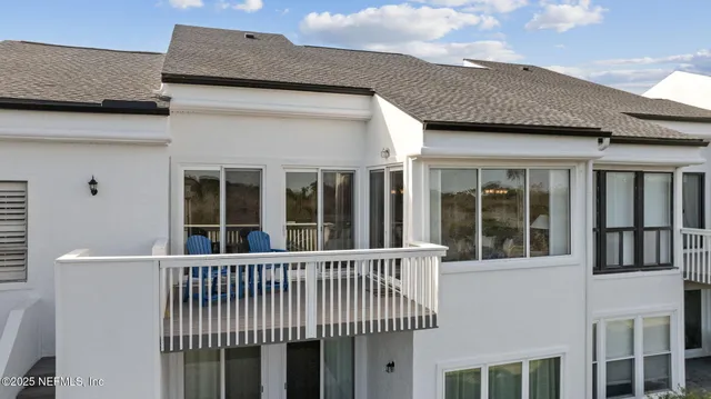 a view of a swimming pool with a yard