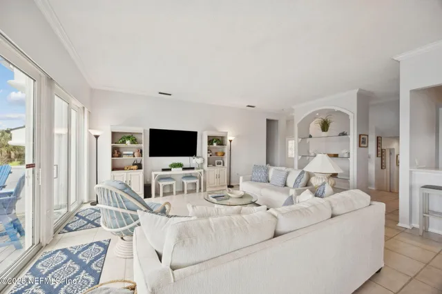 a view of kitchen with furniture and refrigerator