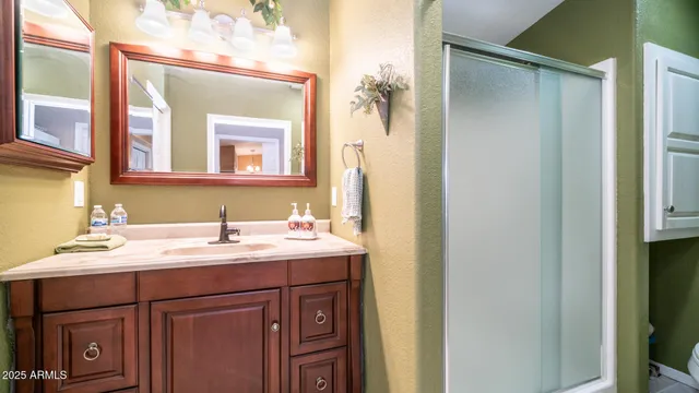 a white toilet sitting next to a bathroom sink
