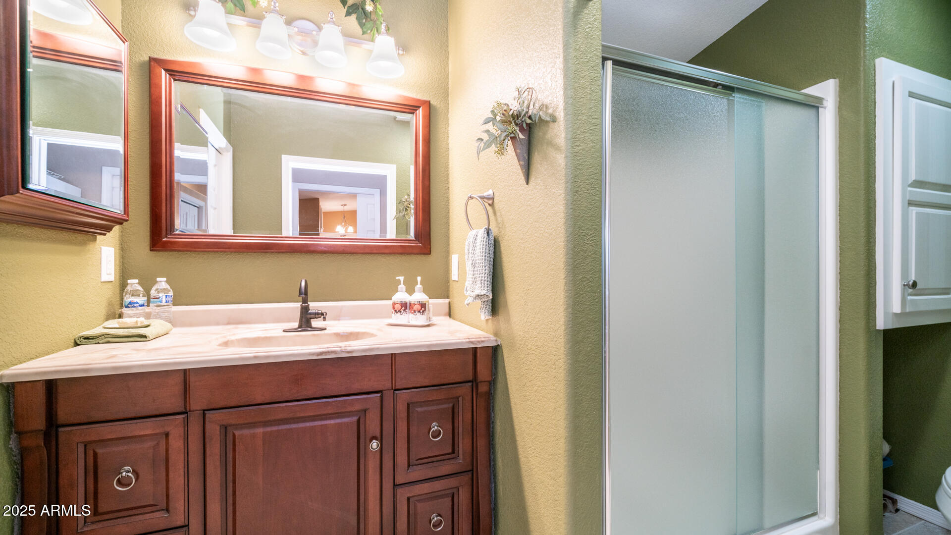 361 Felspar Drive Apache Junction, AZ 85119 - Photo 11 of 71 a bathroom with a sink and a mirror