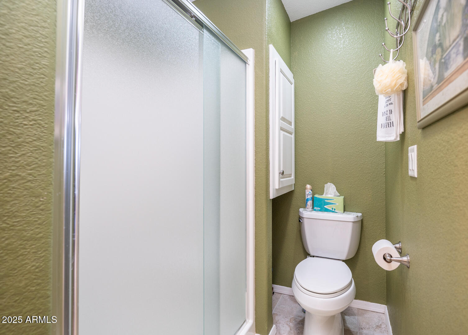 361 Felspar Drive Apache Junction, AZ 85119 - Photo 12 of 71 a white toilet sitting next to a bathroom sink