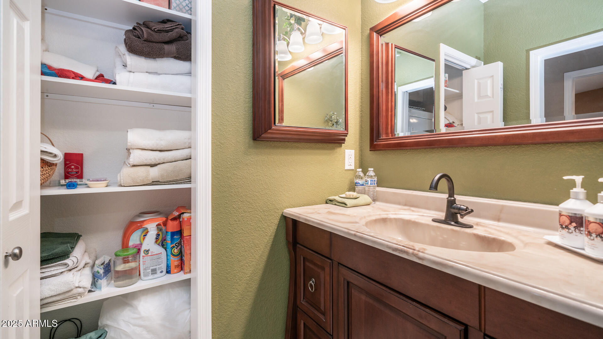 361 Felspar Drive Apache Junction, AZ 85119 - Photo 13 of 71 a bathroom with a sink and a mirror
