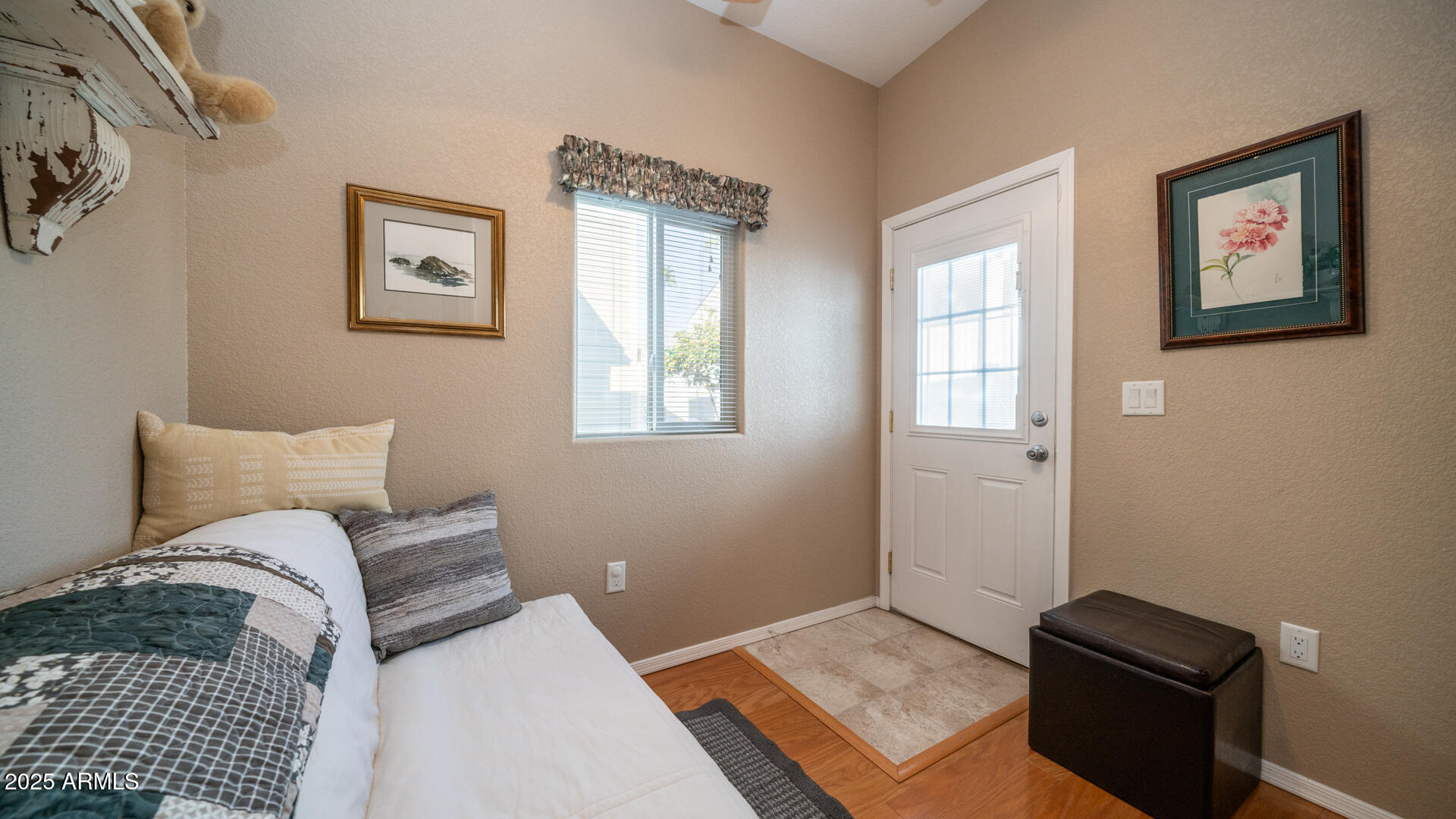 361 Felspar Drive Apache Junction, AZ 85119 - Photo 14 of 71 a bedroom with a bed and a window