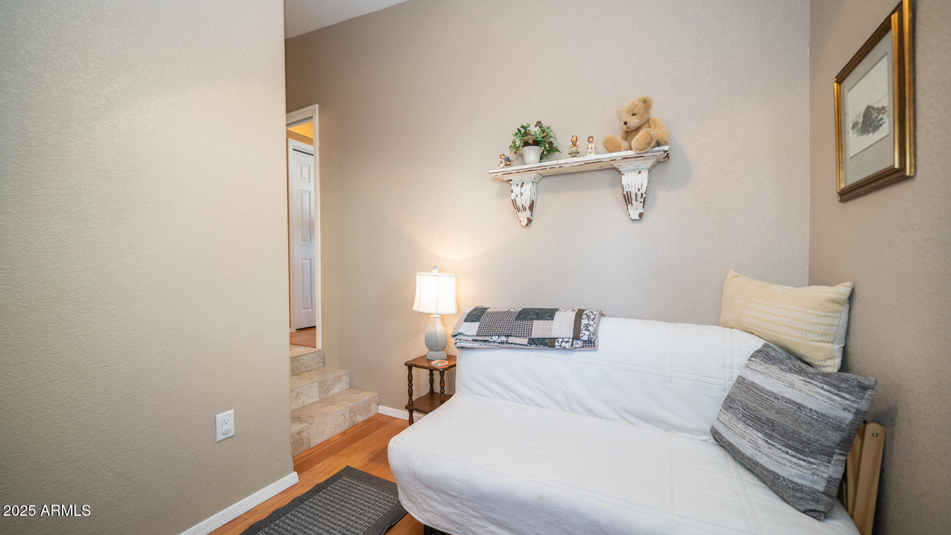 361 Felspar Drive Apache Junction, AZ 85119 - Photo 15 of 71 a bedroom with a bed and wooden floor