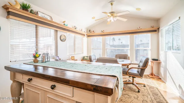 a dinning room with a table and chairs