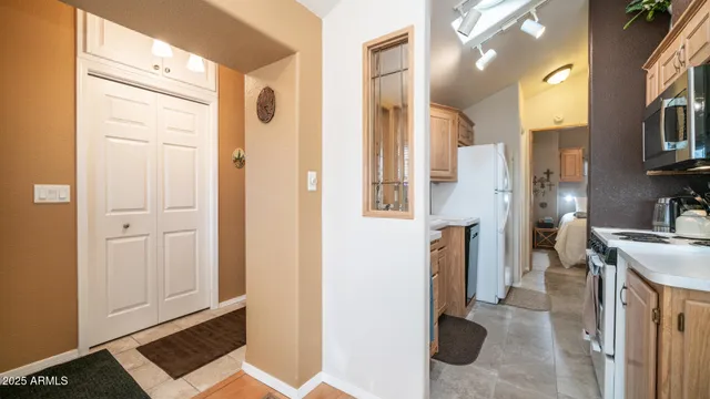 a kitchen with stainless steel appliances granite countertop a stove and a microwave