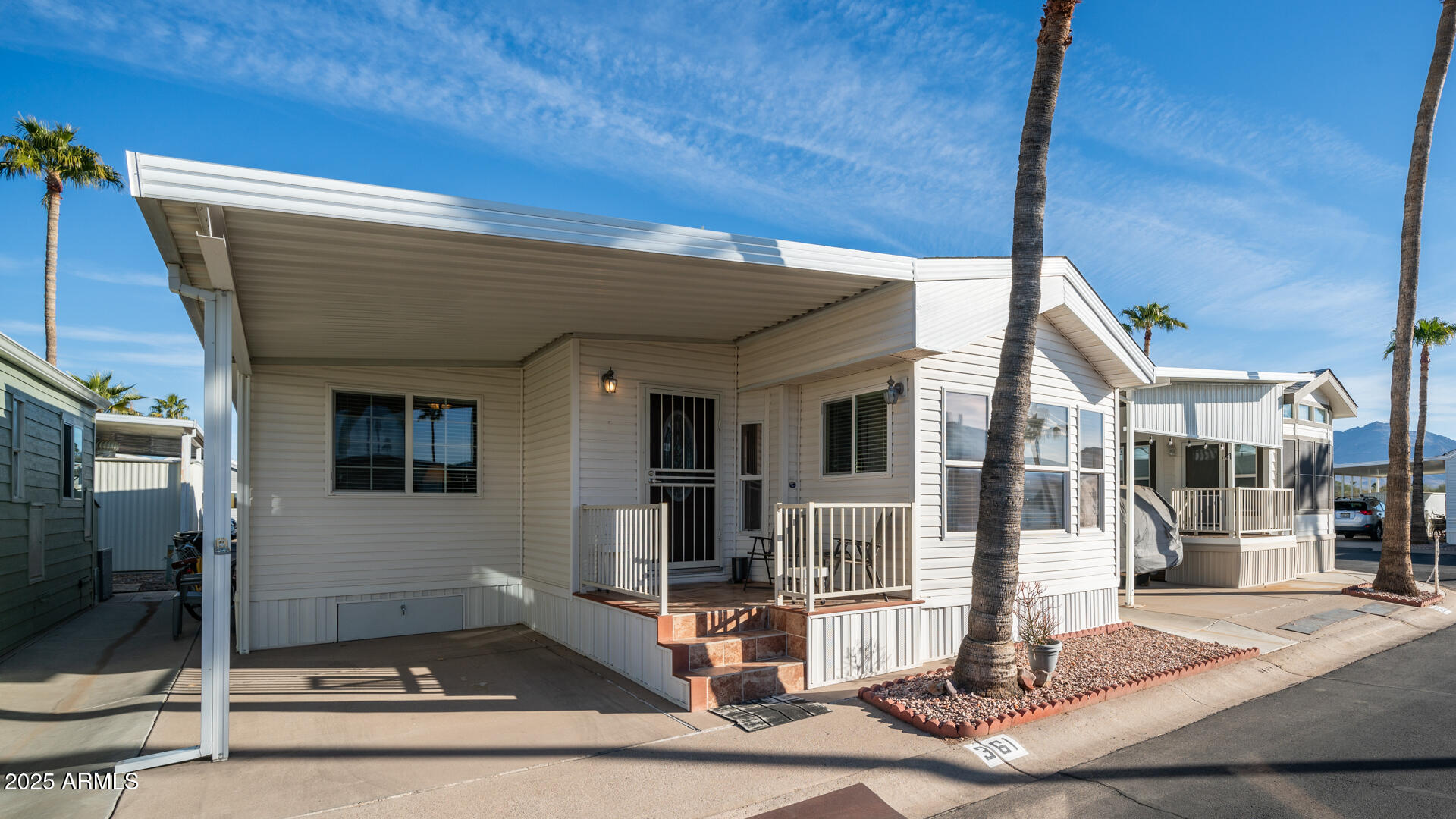361 Felspar Drive Apache Junction, AZ 85119 - Photo 2 of 71 a front view of a house with street