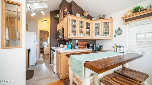 a kitchen with stainless steel appliances granite countertop a stove and a refrigerator