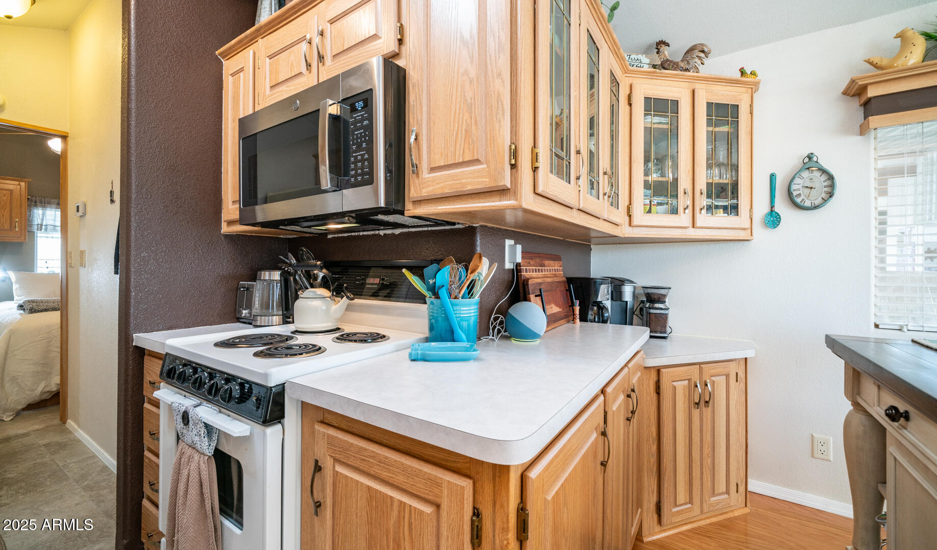 361 Felspar Drive Apache Junction, AZ 85119 - Photo 22 of 71 a kitchen with stainless steel appliances granite countertop a stove and a microwave