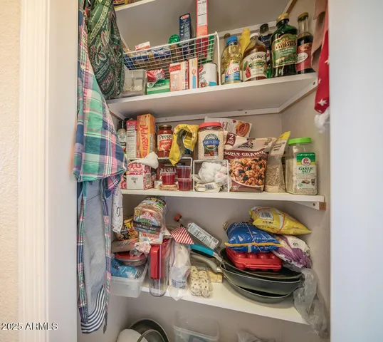 a view of a patio with table and chairs and wooden floor