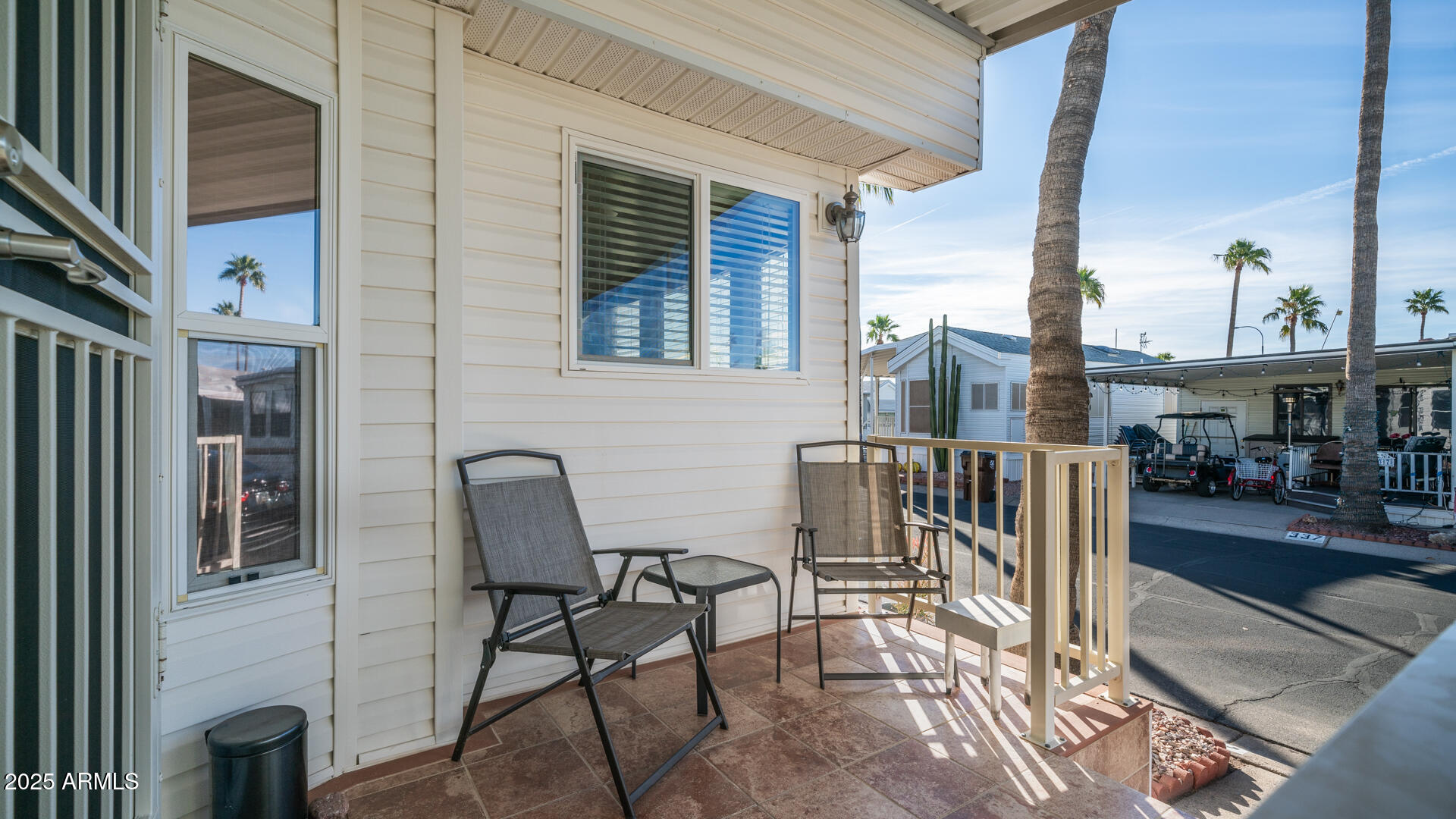 361 Felspar Drive Apache Junction, AZ 85119 - Photo 34 of 71 a view of a patio with table and chairs and wooden floor