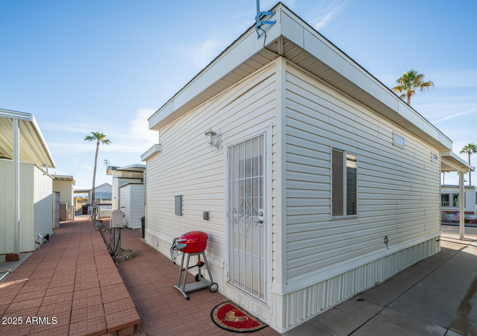 361 Felspar Drive Apache Junction, AZ 85119 - Photo 37 of 71 a view of a house with a potted plant