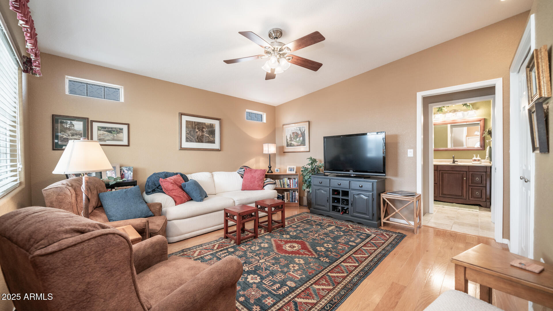 361 Felspar Drive Apache Junction, AZ 85119 - Photo 7 of 71 a living room with furniture and a flat screen tv
