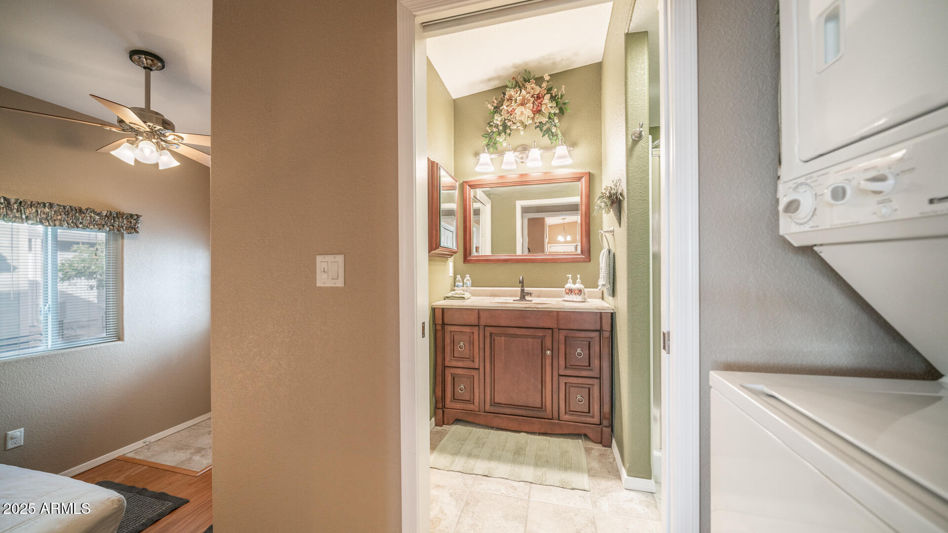 361 Felspar Drive Apache Junction, AZ 85119 - Photo 9 of 71 a bathroom with a granite countertop sink and a mirror
