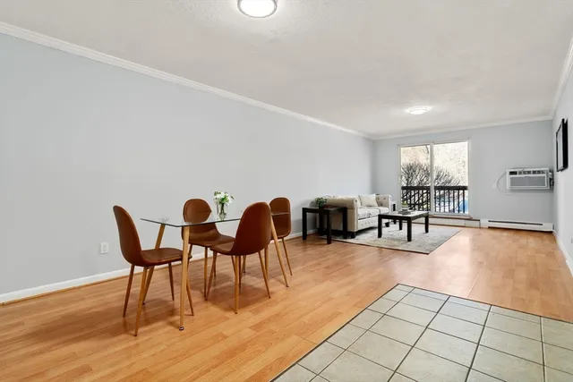 a living room with fireplace furniture and a table