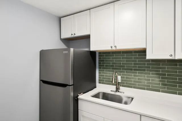 a bathroom with a sink and a washing machine