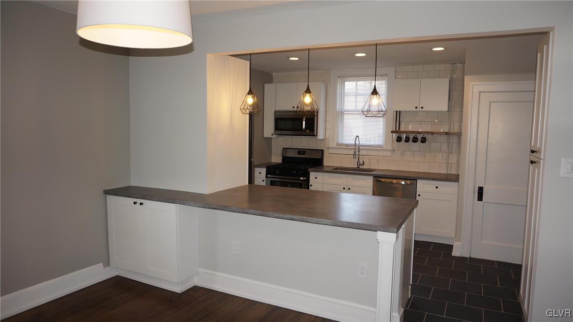 808 Pembroke Road Bethlehem, PA 18018 - Photo 12 of 44 a large kitchen with stainless steel appliances a large counter top
