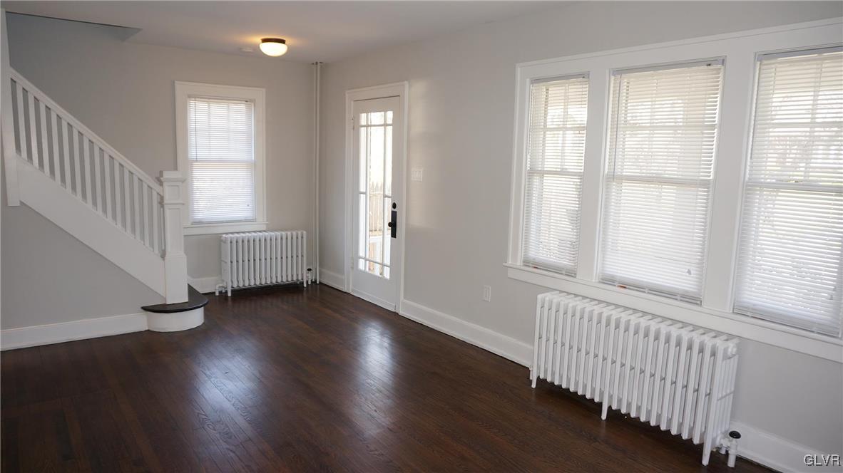 808 Pembroke Road Bethlehem, PA 18018 - Photo 8 of 44 an empty room with wooden floor and windows