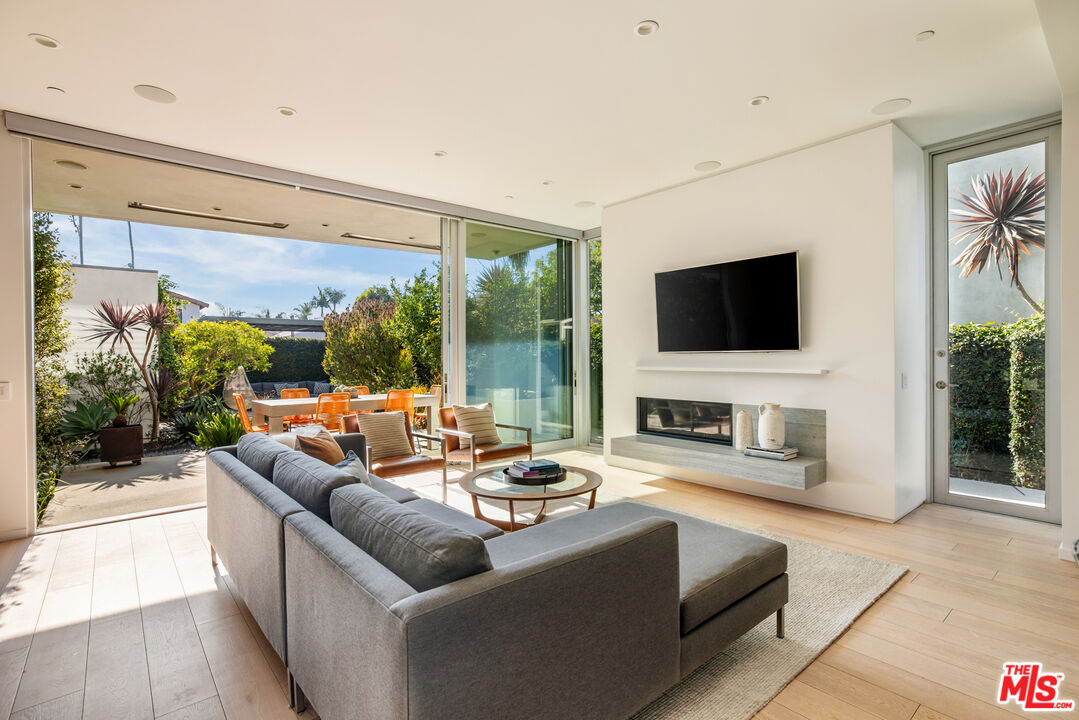 2901 Grayson Avenue Venice, CA 90291 - Photo 6 of 35 a living room with fireplace furniture and a flat screen tv