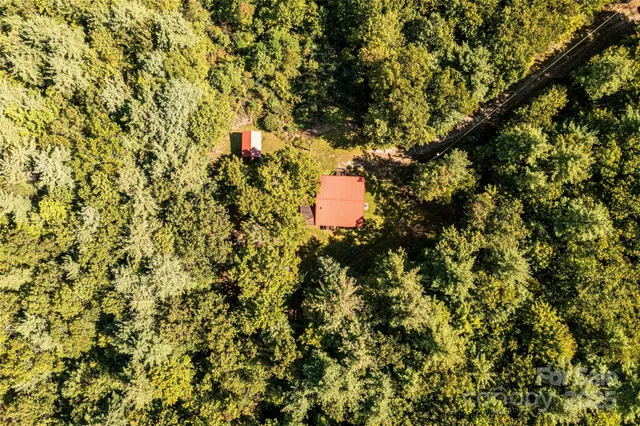 a backyard of a house with a yard and outdoor seating