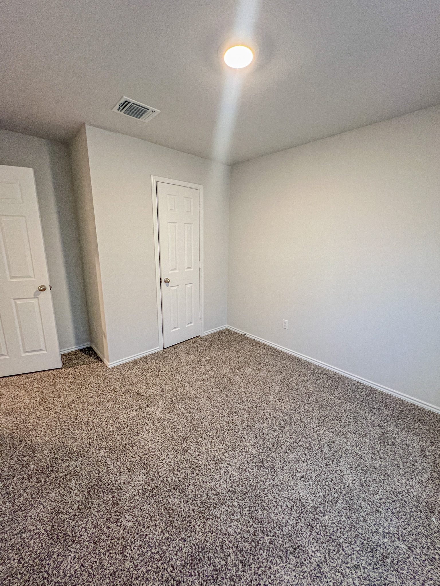 100 Taggart Trail Jarrell, TX 76537 - Photo 6 of 18 Carpeted empty room with baseboards