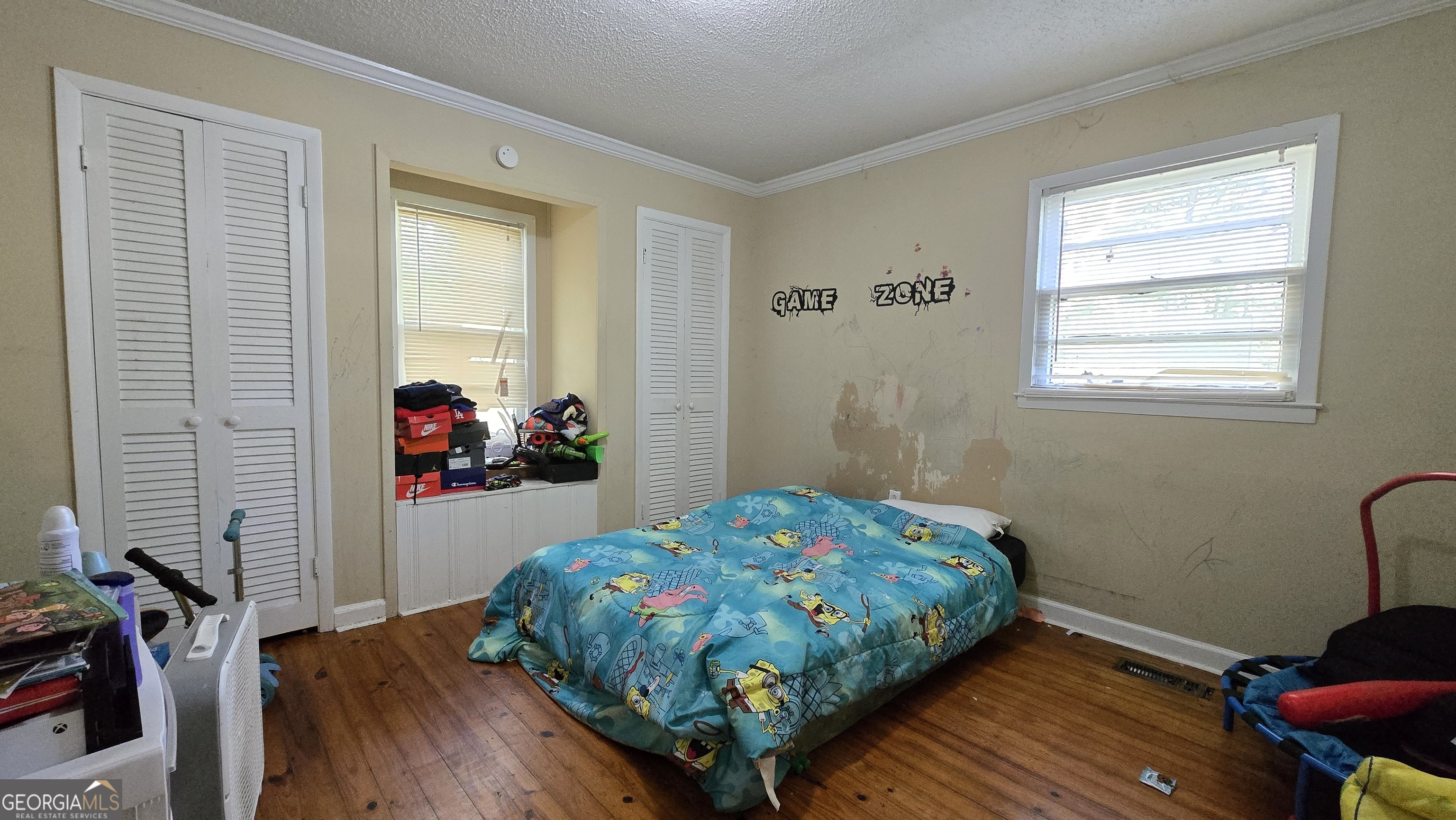 377 Dock Hyde Road Carrollton, GA 30116 - Photo 11 of 32 a bedroom with a bed and a window