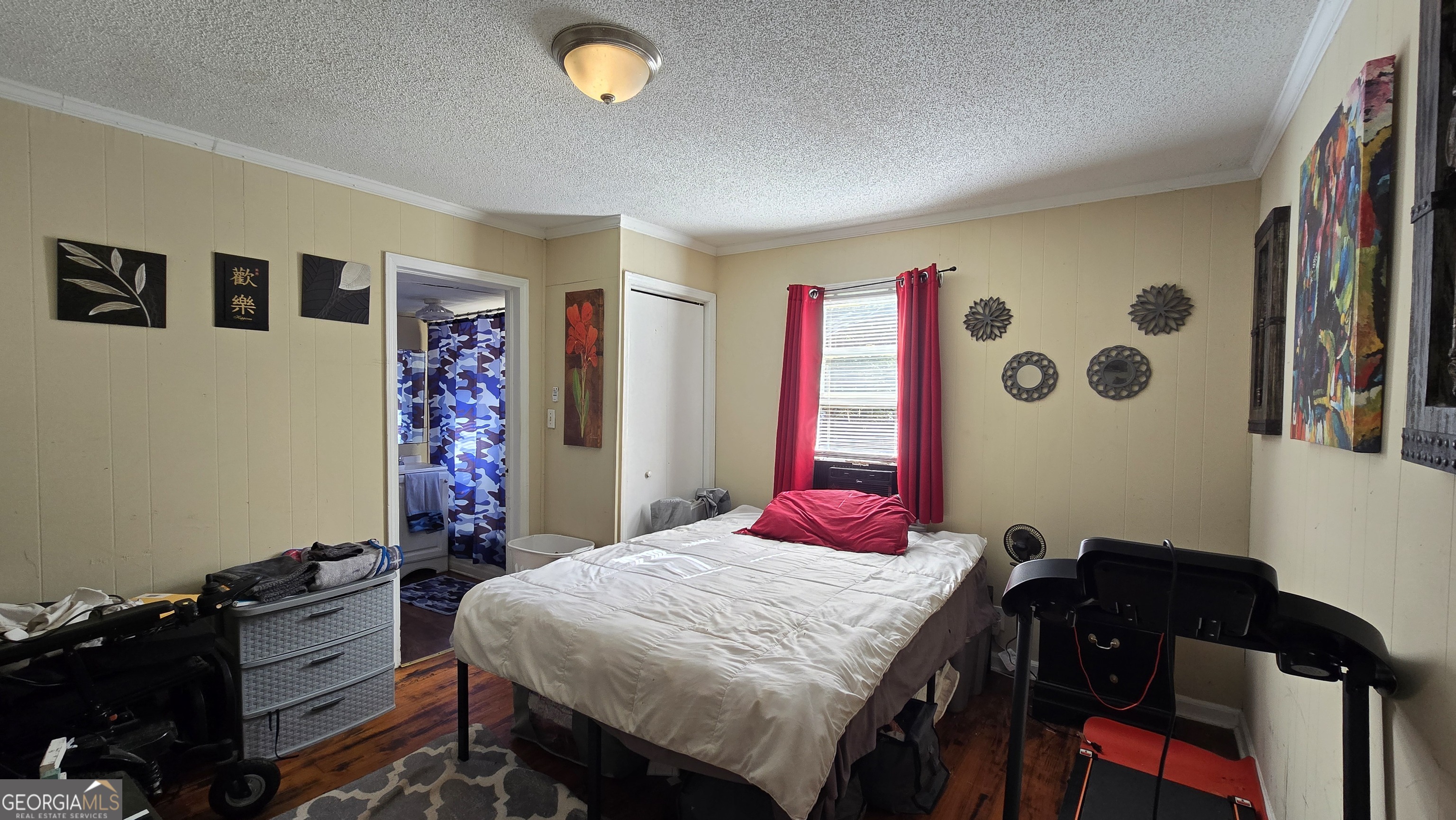 377 Dock Hyde Road Carrollton, GA 30116 - Photo 27 of 32 a bed room with a bed and a computer on a desk next to a window