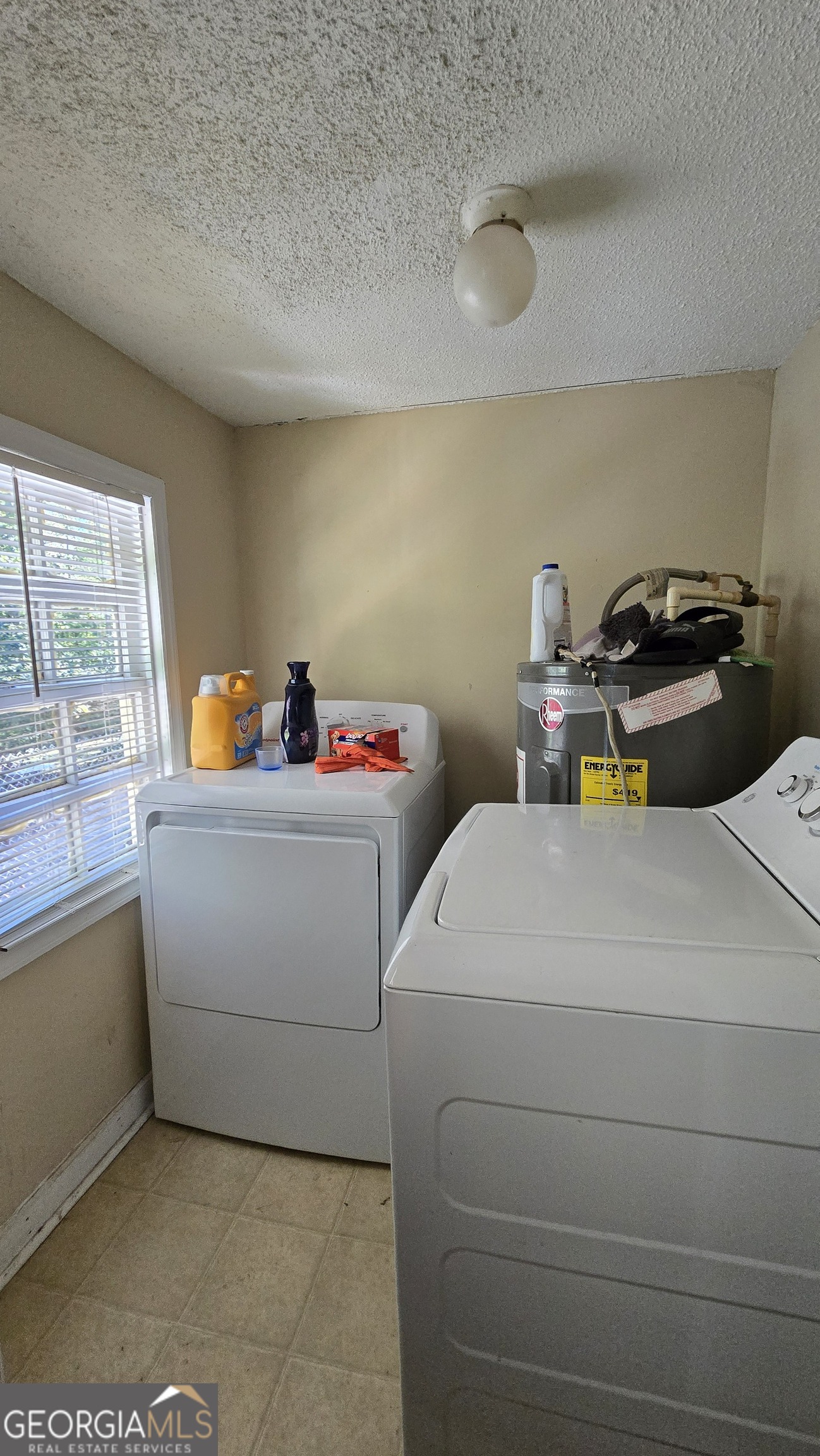 377 Dock Hyde Road Carrollton, GA 30116 - Photo 31 of 32 a utility room with dryer and washer