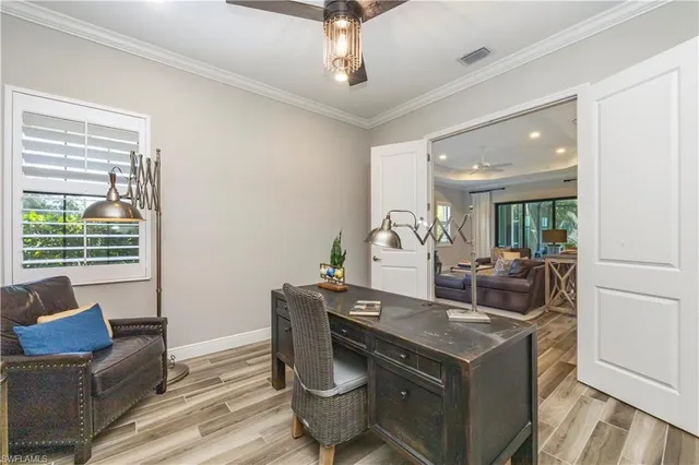 a view of living room with furniture and window