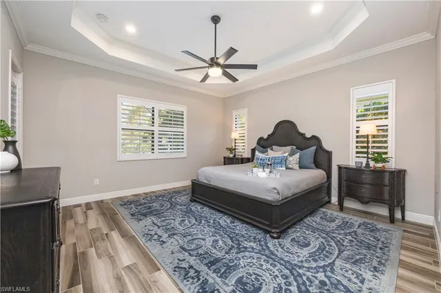 a living room with a bed furniture and a window