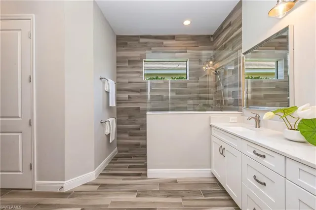 a bathroom with a sink and a mirror