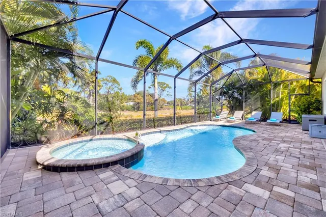 a view of a swimming pool with a patio