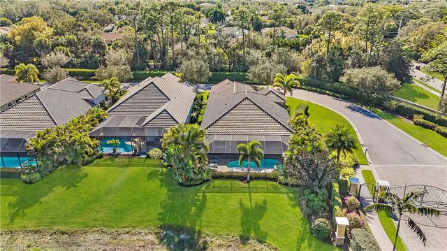 an aerial view of house with yard swimming pool and outdoor seating