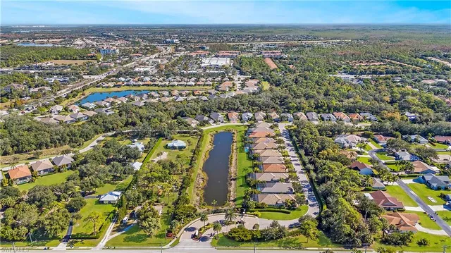 an aerial view of residential building and lake