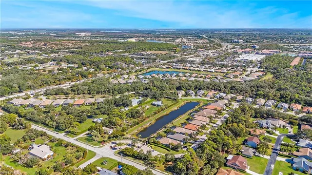 an aerial view of residential building and lake