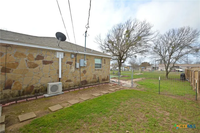 a backyard of a house with lots of green space