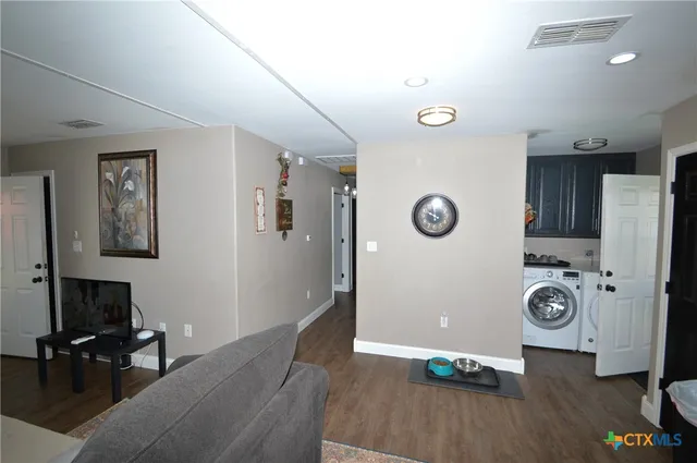 a view of workspace with wooden floor