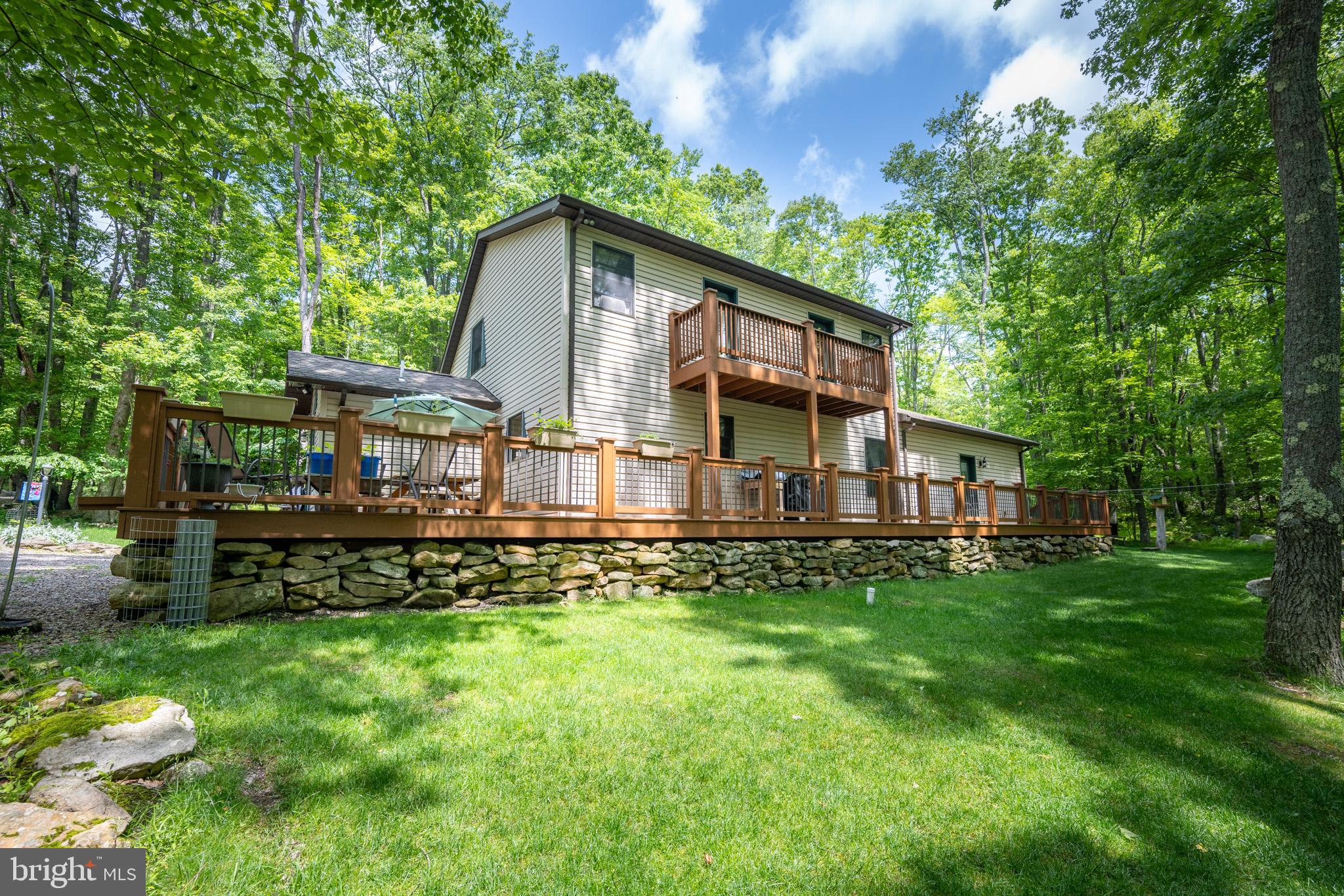 328 Stool Rock Road Oakland, MD 21550 - Photo 13 of 133 a view of a house with a yard