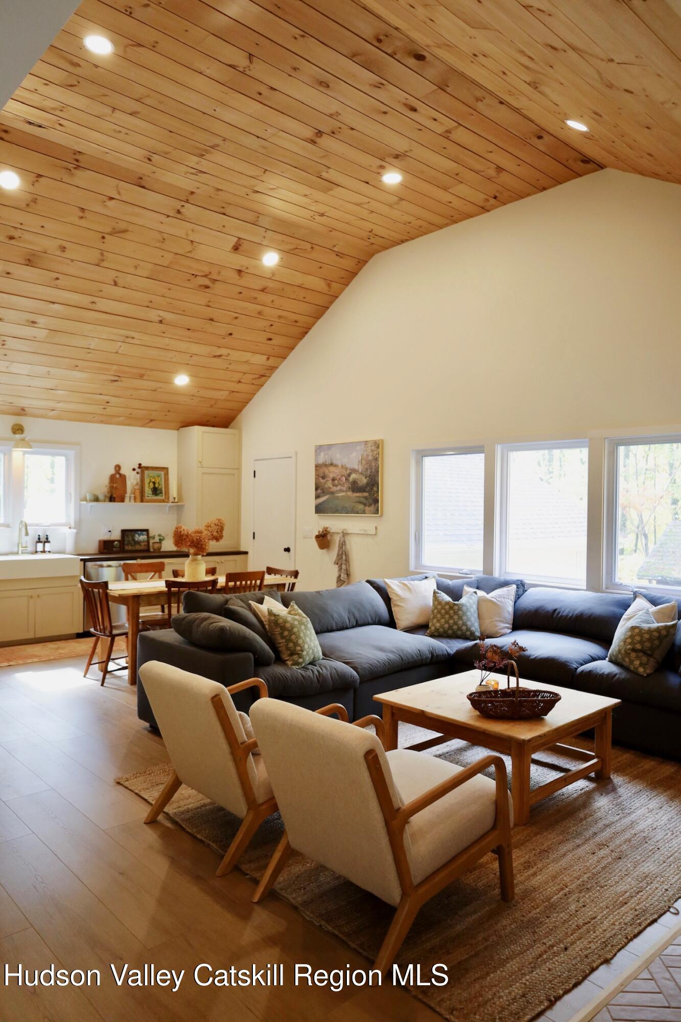 230 Potic Mountain Road Athens, NY 12414 - Photo 4 of 25 a living room with lots of furniture and a wooden floor