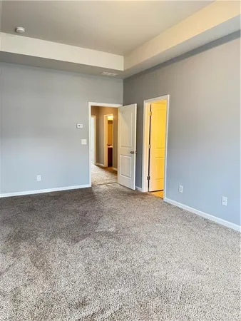 an empty room with a empty space and a window