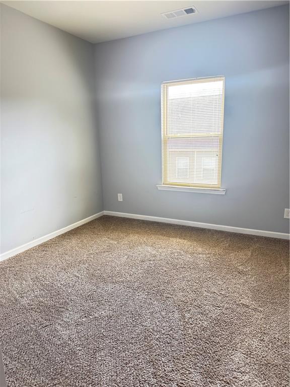 183 Spring Way Square Canton, GA 30114 - Photo 20 of 29 an empty room with a window