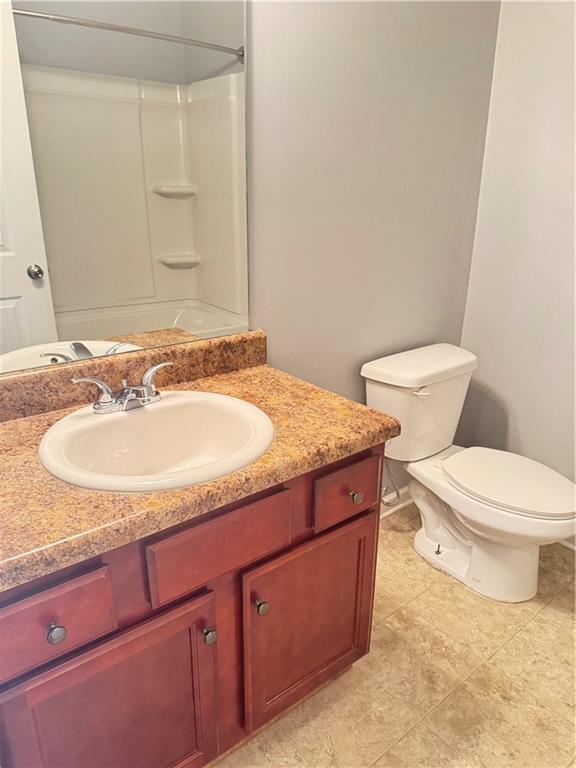 183 Spring Way Square Canton, GA 30114 - Photo 22 of 29 a bathroom with a granite countertop sink and a mirror