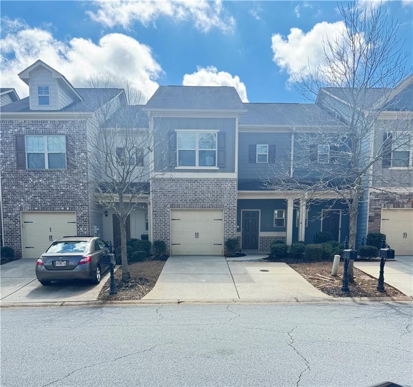 183 Spring Way Square Canton, GA 30114 - Photo 29 of 29 a car parked in front of a brick building
