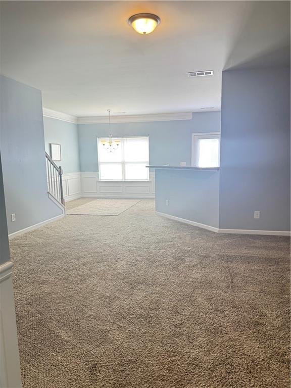183 Spring Way Square Canton, GA 30114 - Photo 4 of 29 an empty room with windows and entrance