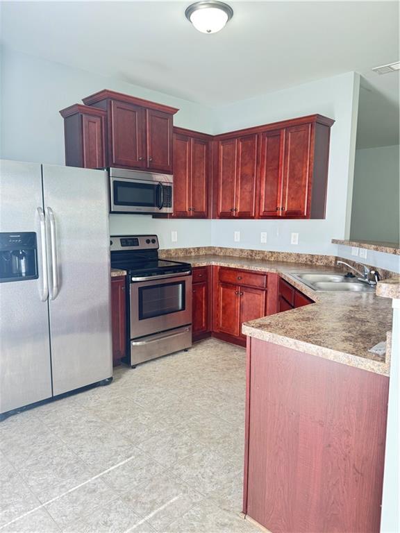 183 Spring Way Square Canton, GA 30114 - Photo 9 of 29 a kitchen with a sink a stove and a refrigerator