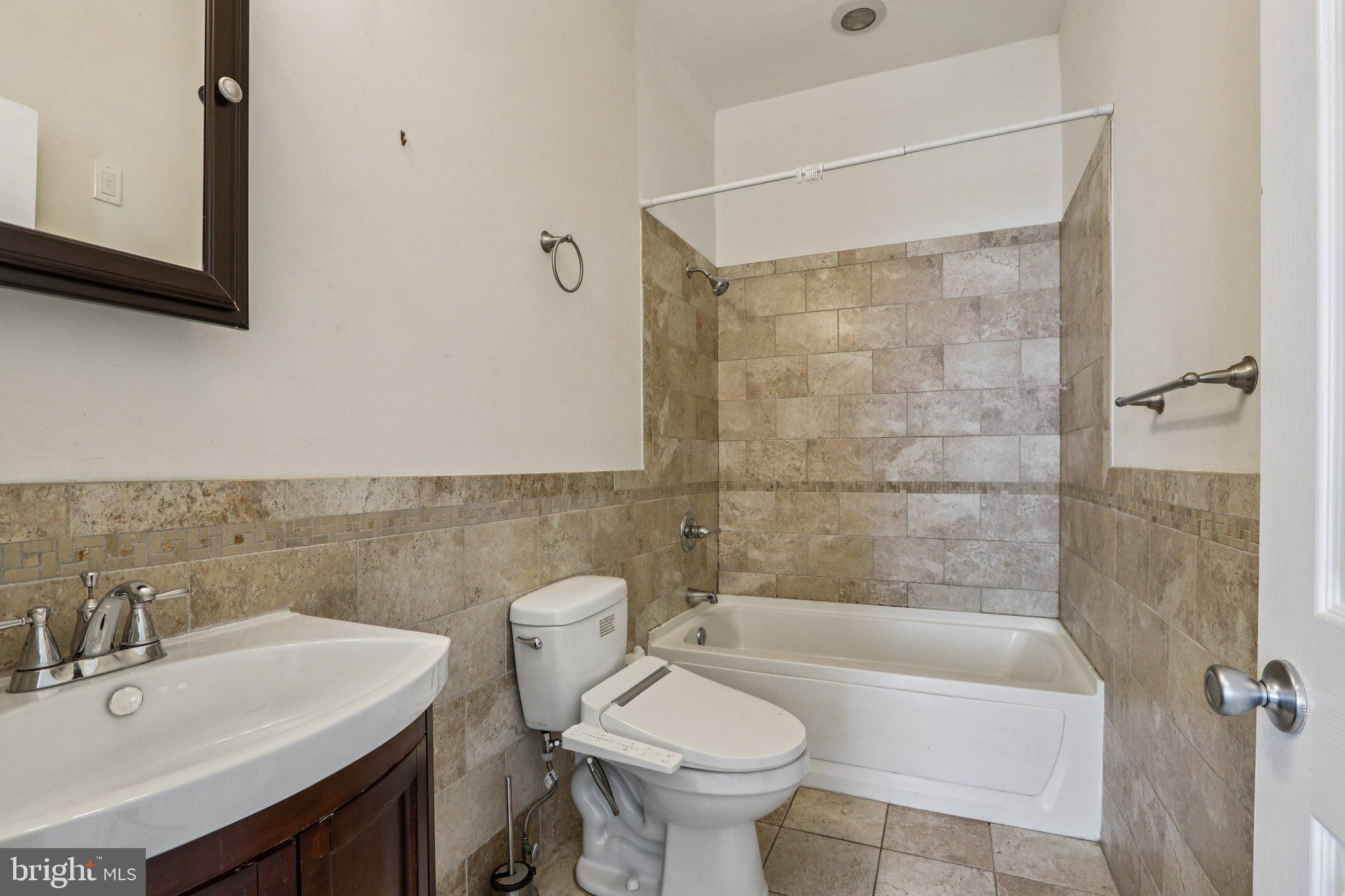 605 North 12th Street, Unit B Philadelphia, PA 19123 - Photo 12 of 22 a bathroom with a sink toilet and shower