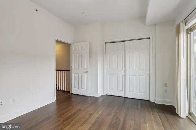 a view of a livingroom with wooden floor