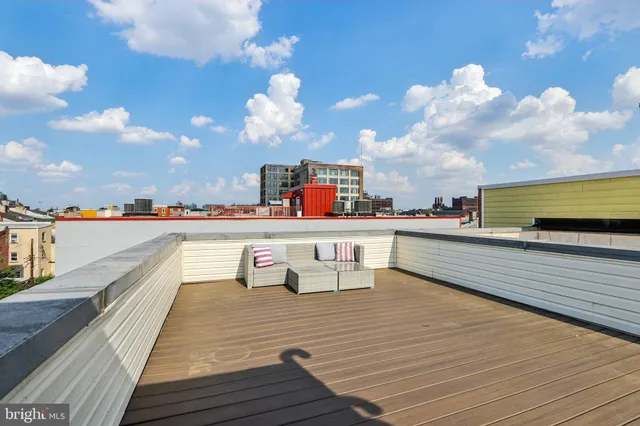 a view of a terrace with wooden floor