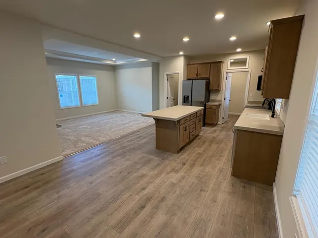 a view of living room with furniture and a wooden floor