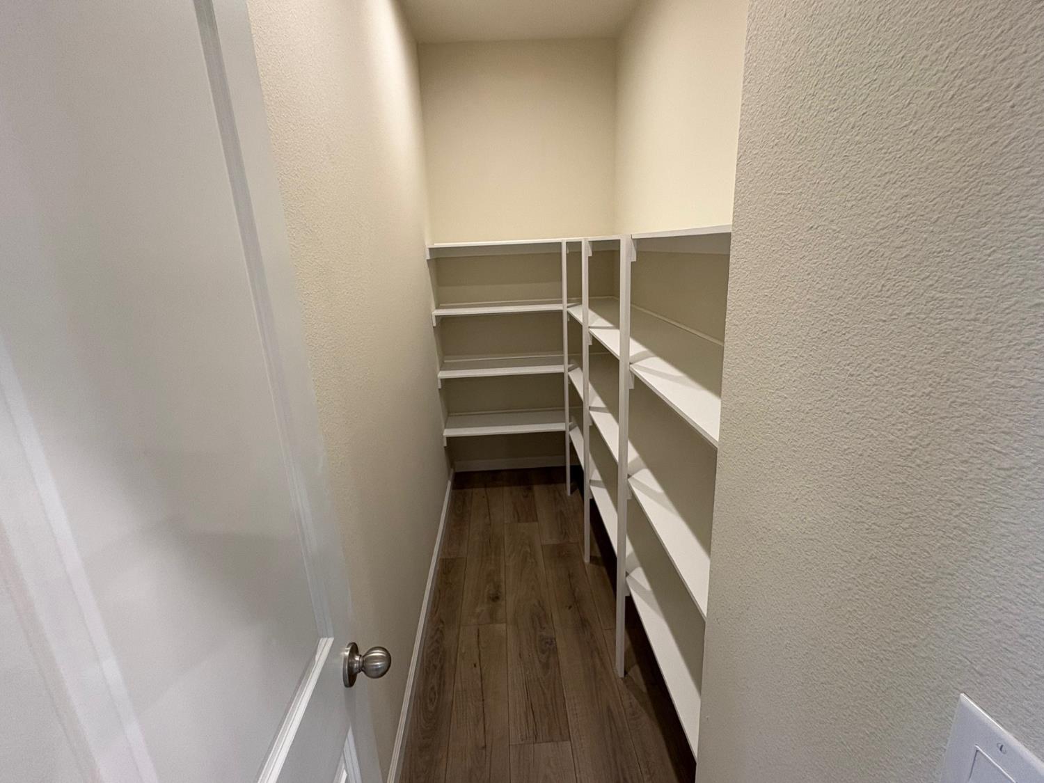 Undisclosed Address Medford, OR 97501 - Photo 5 of 9 a view of walk in closet with empty racks